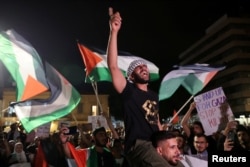A Palestinian shouts slogans during an anti-war protest in Nicosia, Cyprus, Oct. 20, 2023.