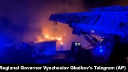 In this photo released by Belgorod Regional Governor Vyacheslav Gladkov's Telegram channel on Aug. 30, 2024, firefighters extinguish fire after a missile attack by the Armed Forces of Ukraine on the city of Belgorod and the Belgorod region. 