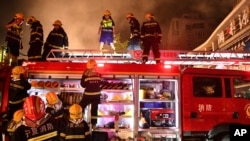 FILE - Photo by Xinhua News Agency shows firefighters at the site of an explosion at a restaurant in Yinchuan, northwest China's Ningxia Hui Autonomous Region, June 21, 2023.