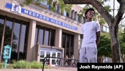 Flerentin “Flex” Jean-Baptiste, 16, of Medford, Mass., poses for a photo at Medford High School, Friday, Aug. 2, 2024, in Medford. (AP Photo/Josh Reynolds)