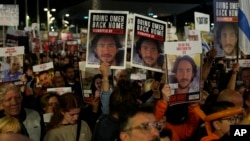 Friends and relatives of the Israeli hostages held in the Gaza Strip by the Hamas militant group attend a rally calling for their release, Dec. 9, 2023, in Tel Aviv, Israel.