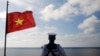 FILE - A Vietnamese naval soldier stands guard at Thuyen Chai island in the Spratly archipelago in the South China Sea on Jan. 17, 2013. 