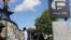 FILE - A survivor of the Pulse nightclub shooting looks at the photos that are a part of the Pulse memorial in Orlando, Florida, Sept. 9, 2022. The 49 victims killed and dozens more survivors of the massacre were remembered Monday with the unveiling of a mural.