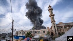 FILE - Smoke rises following an Israeli bombardment on Rafah, southern Gaza Strip, Dec. 20, 2023.