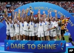 FILE - Team USA celebrates after winning the Women's World Cup soccer final against the Netherlands in Lyon, France, July 7, 2019. The U.S. will be playing for an unprecedented three-peat at the Women's World Cup this summer.