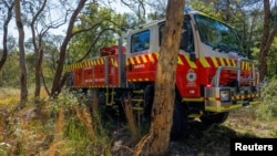 FILE — A New South Wales Rural Fire Service firetruck is seen at a hazard reduction burn site in Sydney, Australia, Sept. 10, 2023. Australia's southeast is going through a heat wave that has raised the risk of bushfires.