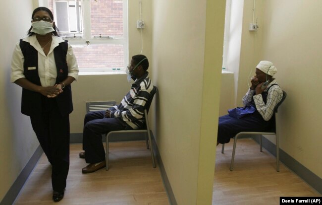 FILE - Patients use nebulizers during a test for the presence of TB, at the Tembalete, a U.S. funded Right to Care Clinic at the Helen Joseph Hospital in Johannesburg Wednesday, Dec 17, 2008. (AP Photo/Denis Farrell, File)