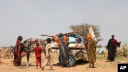 FILE- Sudanese refugees who fled the conflict in Sudan gather July 1, 2023 at the Zabout refugee Camp in Goz Beida, Chad.