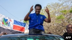 FILE - Venancio Mondlane gestures to supporters gathered to celebrate the results in the local elections in Maputo on Oct. 12, 2023. Mondlane is running as an independent in Mozambique's presidential election on Oct. 9, 2024. 