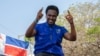 FILE - Venancio Mondlane gestures to supporters gathered to celebrate the results in the local elections in Maputo, Mozambique, Oct. 12, 2023. Mondlane finished second in Mozambique's presidential election on Oct. 9, 2024. 