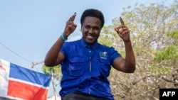 FILE - Venancio Mondlane gestures to supporters gathered to celebrate the results in the local elections in Maputo, Mozambique, Oct. 12, 2023. Mondlane finished second in Mozambique's presidential election on Oct. 9, 2024. 