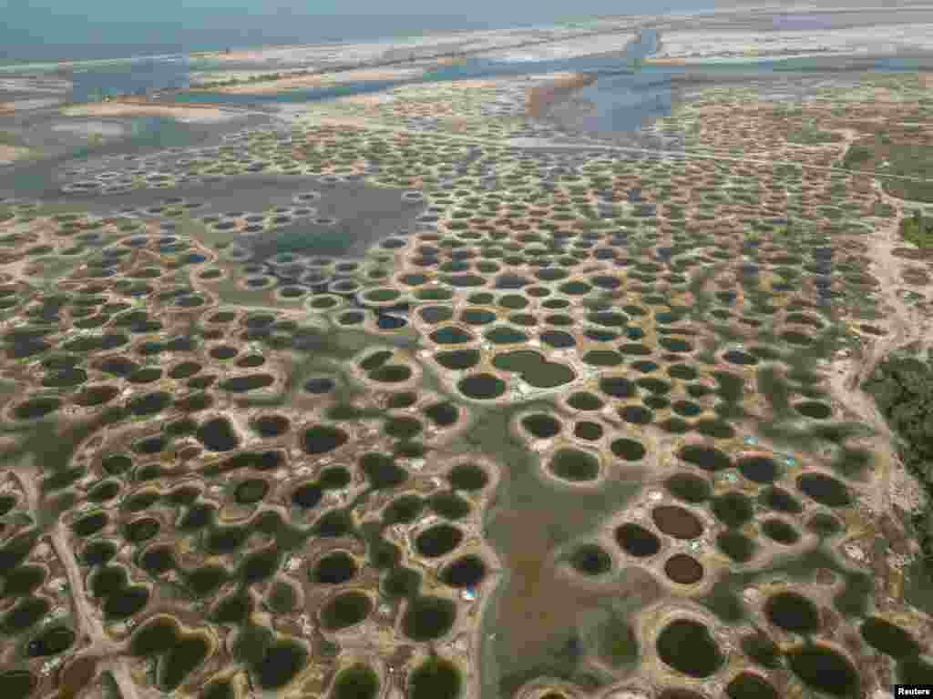A view over salt wells in Palmarin, Sine Saloum Delta region which is classified as UNESCO world heritage site, Senegal.