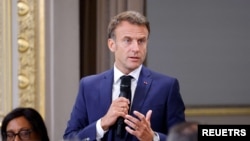 France's President Emmanuel Macron addresses mayors of cities affected by the violent clashes that erupted after a teen was shot dead by police last week, during a meeting at the presidential Elysee Palace in Paris, France, July 4, 2023. 