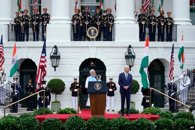 President Joe Biden listens as India's Prime Minister Narendra Modi speaks during a State Arrival Ceremony on the South Lawn of the White House, June 22, 2023, in Washington.