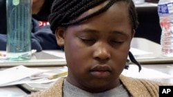 Aniyah Woods meditates in her classroom at Roberta T. Smith Elementary School, May 14, 2024, in Rex, Georgia. Schools across the U.S. have been introducing yoga, meditation and mindfulness exercises to help students manage stress and emotions. (AP Photo/Sharon Johnson)