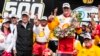Josef Newgarden celebrates with his team and car owner Roger Penske, left, after winning the Indianapolis 500 auto race at Indianapolis Motor Speedway in Indianapolis, May 28, 2023. 
