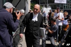 Andrew Green, the lead lawyer for Mirror Group Newspapers, passes by media at the High Court in London, June 7, 2023.