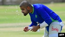 Pakistan's cricket captain Babar Azam cools off during a practice session at the National Stadium in Karachi on July 4, 2023, ahead of their test series tour in Sri Lanka.