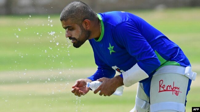 Pakistan's cricket captain Babar Azam cools off during a practice session at the National Stadium in Karachi on July 4, 2023, ahead of their test series tour in Sri Lanka.