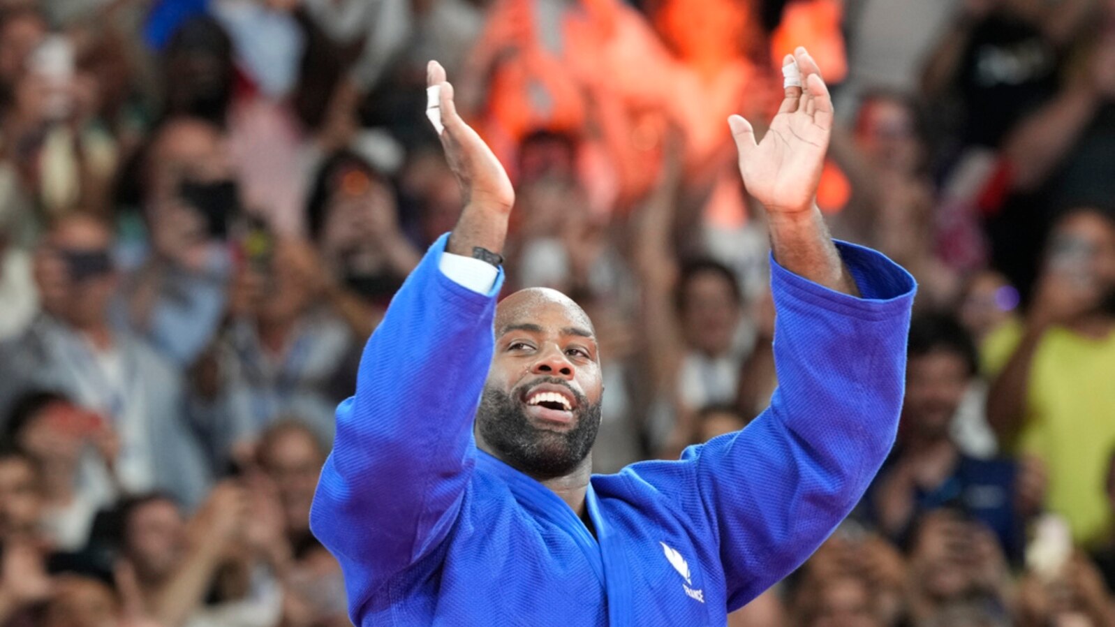 France's Teddy Riner celebrates after defeating South Korea's Min-Jong Kim during their men's +100 kg final match in the team judo competition, at Champ-de-Mars Arena, during the 2024 Summer Olympics, in Paris, France.