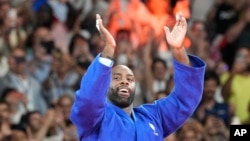 France's Teddy Riner celebrates after defeating South Korea's Min-Jong Kim during their men's +100 kg final match in the team judo competition, at Champ-de-Mars Arena, during the 2024 Summer Olympics, in Paris, France.