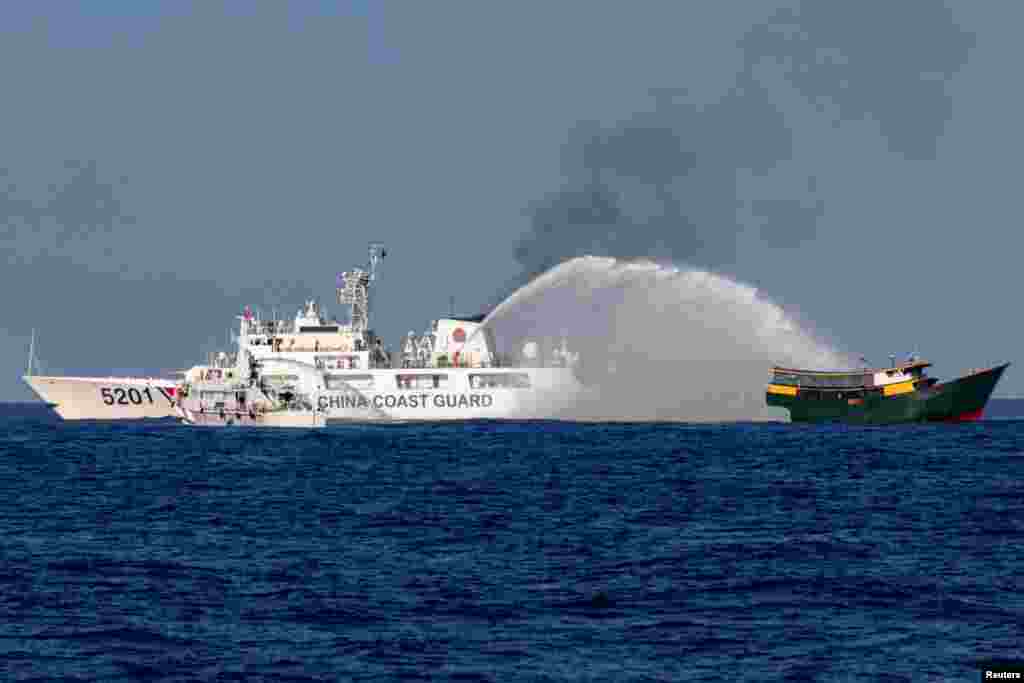 Chinese Coast Guard vessels fire water cannons towards a Philippine resupply vessel Unaizah May 4 on its way to a resupply mission at Second Thomas Shoal in the South China Sea, March 5, 2024.