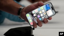 In this file photo, the iPhone 15 Pro is shown after its introduction on the Apple campus, Sept. 12, 2023, in Cupertino, Calif. (AP Photo/Jeff Chiu, File)