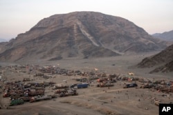 Afghan refugees settle in a camp near the Torkham Pakistan-Afghanistan border, in Torkham, Afghanistan, Friday, Nov. 3, 2023. (AP Photo/Ebrahim Noroozi)