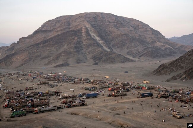 Afghan refugees settle in a camp near the Torkham Pakistan-Afghanistan border, in Torkham, Afghanistan, Friday, Nov. 3, 2023. (AP Photo/Ebrahim Noroozi)