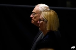 Kathy Cade, a longtime aide to former first lady Rosalynn Carter, pauses at her casket at the Jimmy Carter Presidential Library and Museum in Atlanta, Nov. 27, 2023, during a public repose.