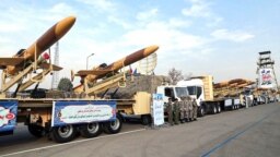 A handout photo provided by the Iranian Army media office Dec. 10, 2023, shows Iranian Karrar drones during their unveiling in Tehran.