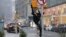 Dancer Skye Madison Murphy poses for a photographer as snow falls in New York City, Jan. 6, 2024. 