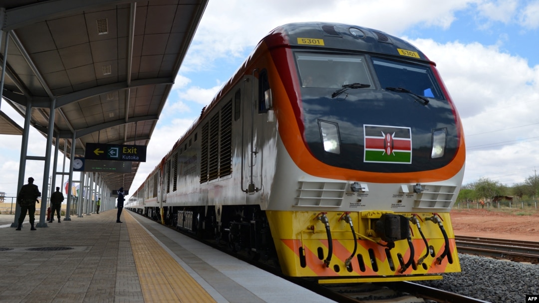 FILE - One of Kenya's newly acquired standard gauge rail locomotive rolls into Voi railway station on May 31, 2017, in Voi, Kenya, on the inaugural ride of Kenya's new China-financed standard gauge railway from the city of Mombasa to the capital, Nairobi.