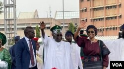 Bola Tinubu (center, in white) was sworn in on Monday, May 29, 2023 as Nigeria's president, succeeding Muhammadu Buhari. 