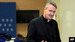 FILE - Rev. Andrew Small, a British-born Oblate of the Mary Immaculate priest, CEO of Missio Corp. speaks during a news conference at the Vatican, March 25, 2023.