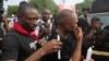 FILE - People light candles during a procession in honor of all protesters killed nationwide at recent economic hardship protests, in Lagos, Nigeria, Aug. 9, 2024. 