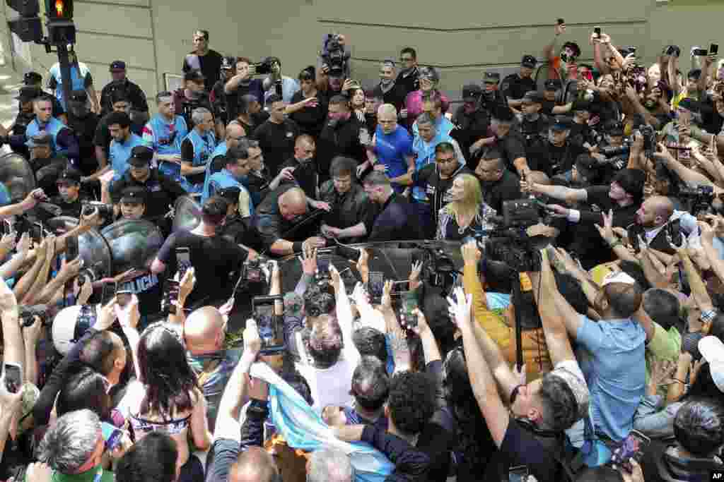 Presidential candidate of the Liberty Advances coalition Javier Milei gets into his car after voting in the presidential runoff election in Buenos Aires, Argentina.