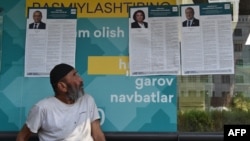 FILE - Campaign posters of presidential candidates are on display in the Uzbek capital of Tashkent on July 7, 2023. 