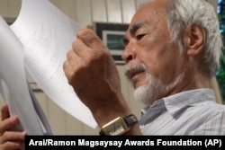 In this undated photo provided by Arai via the Ramon Magsaysay Award Foundation, 2024 Ramon Magsaysay Awardee, Japan's Miyazaki Hayao, reads a script. (Arai/Ramon Magsaysay Awards Foundation via AP)