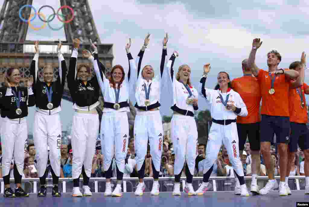 Medalists from Germany, Britain, and Netherlands celebrate during the Champions Park medalists celebrations during the Summer Olympics in Champions Park, Paris, France.