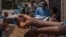 A patient suffering from mpox sits on a bench at the Kavumu hospital, 30 km north of Bukavu in eastern Democratic Republic of Congo, Aug. 24, 2024. 