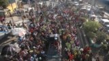 FILE - Factory workers march to demand salary increases in Port-au-Prince, Haiti, May 9, 2023.