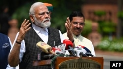 India's Prime Minister Narendra Modi speaks to the media before the opening of the Monsoon session of Parliament in New Delhi, July 20, 2023. Several groups have united to contest him in 2024.