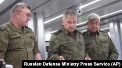 In this photo released on June 26, 2023 by the Russian Defense Ministry Press Service, Russian Defense Minister Sergei Shoigu, center, inspects a command post at an undisclosed location. (Russian Defense Ministry Press Service via AP)