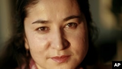 FILE - Rahile Dawut is pictured in Urumqi, the capital of China's far west Xinjiang region, in August 2006, in this handout photo released by Lisa Ross. 