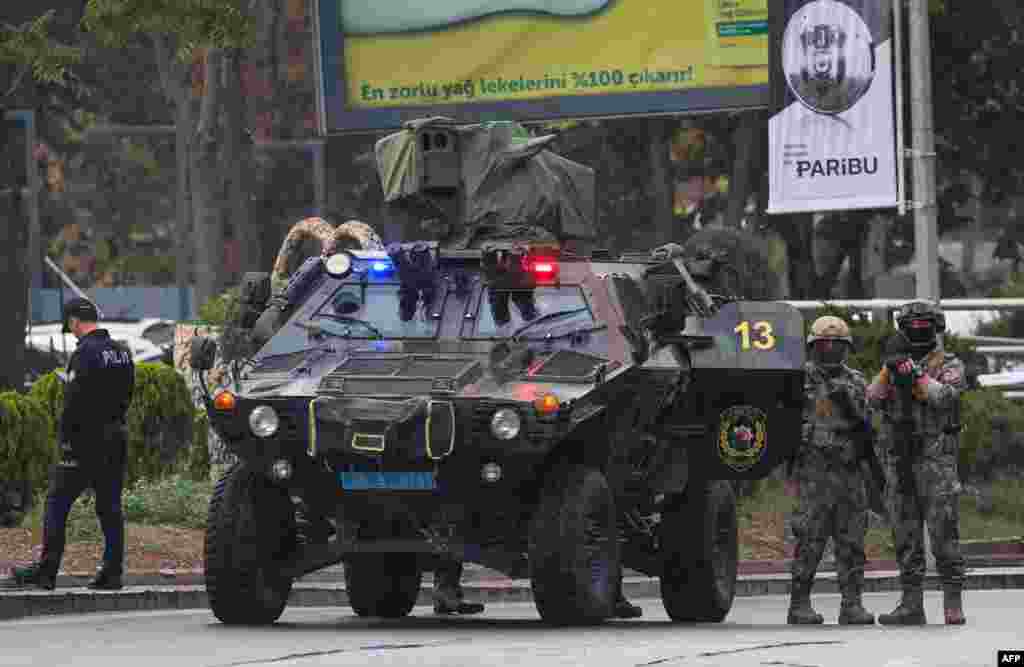 Members of Turkish Police Special Forces secure the area near the Interior Ministry following a bomb attack in Ankara, leaving two police officers injured.