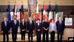 Josep Borrell, left, the European Union's foreign policy chief, stands with the foreign ministers of G7 countries in Tokyo, Nov. 8, 2023. While meeting, the ministers expressed support for humanitarian pauses in the Israeli-Hamas war. 