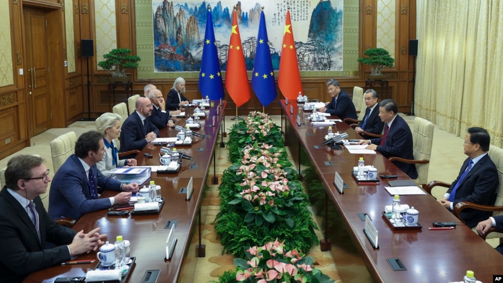 FILE - Chinese President Xi Jinping, second right, talks to European Commission President Ursula von der Leyen, third left, in Beijing, Dec. 7, 2023. Draft EU regulations announced Jan. 24, 2024, appear likely to hit Chinese exports when approved.