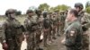 FILE - Russian Security Council Deputy Chairman Dmitry Medvedev, front right, speaks to Russian military members during his visit at a military training range in the Russian-controlled Donetsk region, Ukraine, Sept. 15, 2023. (Pool Sputnik via AP)