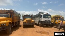 (FILE) A handout image shows aid trucks with relief material for Sudan's Darfur region, at a location given as the border of Chad and Sudan, released on Aug. 21, 2024.